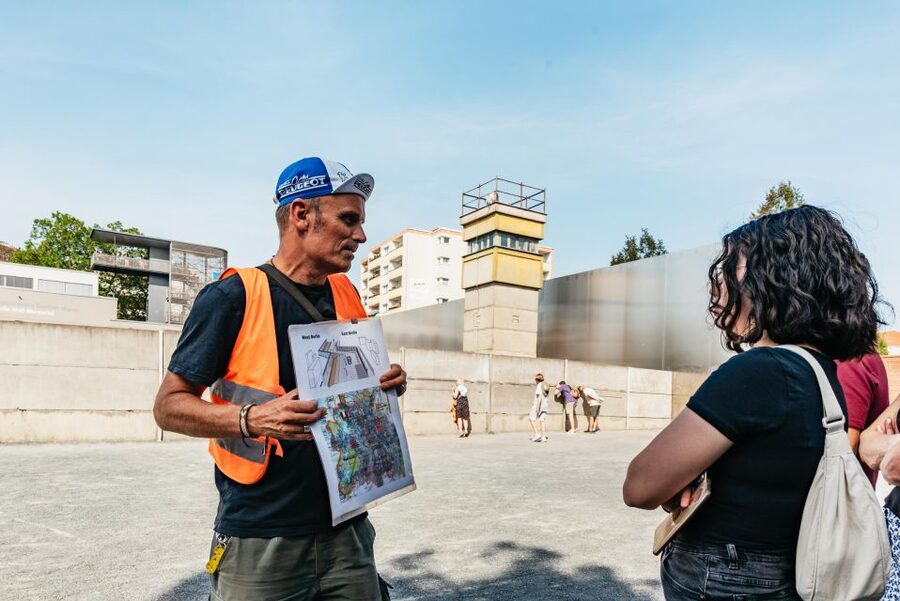 Berlin: Cold War Era History Guided Bike Tour - Checkpoint Charlie and the Cold War symbols