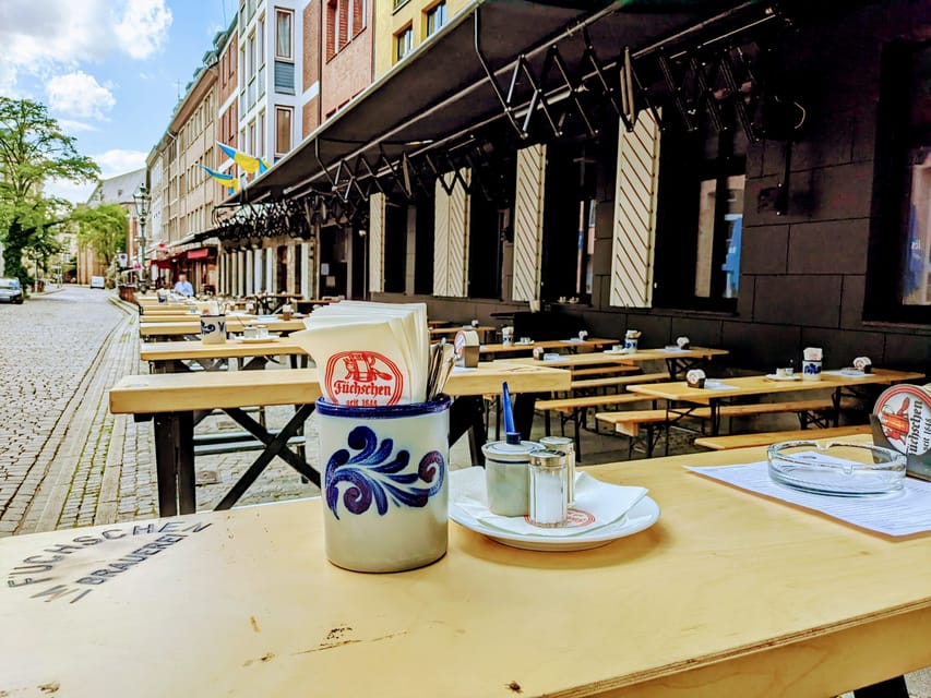 Düsseldorf: Tipping based - Old Town Walking Tour - Königsallee sets up Düsseldorf’s two sides
