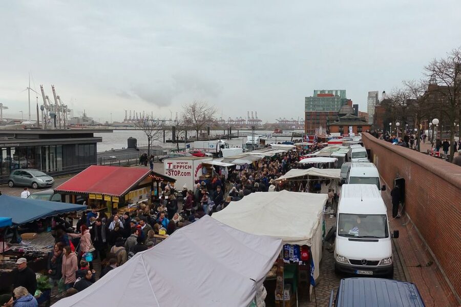 Hamburg: Reeperbahn, Port, & Fish Market Morning Tour - Taking the harbor ferry toward Finkenwerder