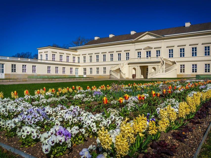 Hanover: Royal Gardens of Herrenhausen Guided Tour - Boxwood, marble, and flower borders