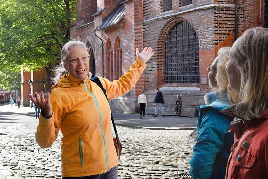 Lübeck: entertaining guided tour to old town highlights - Walking from the gate into Lübeck’s brick-built center