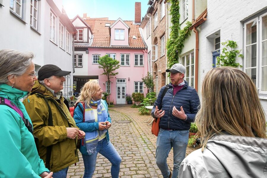 Lübeck: Entertaining Tour Through Hidden Courtyards - Meeting at the Burgtor