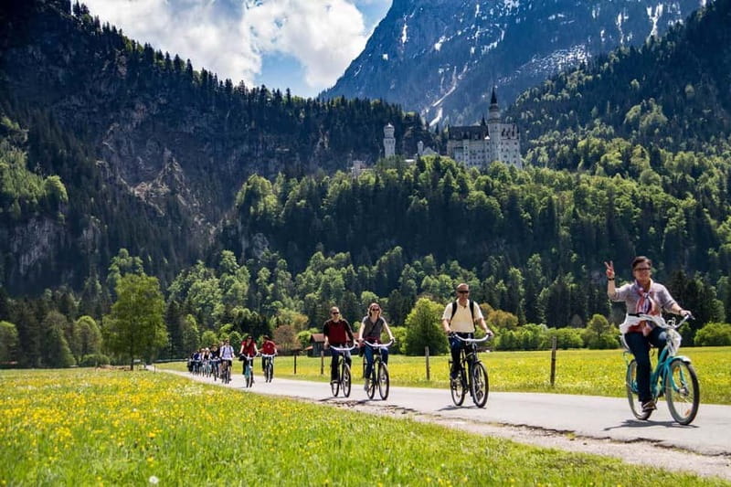 Munich: Neuschwanstein Castle by Bus with Alpine Bike Ride - The summer lake swim
